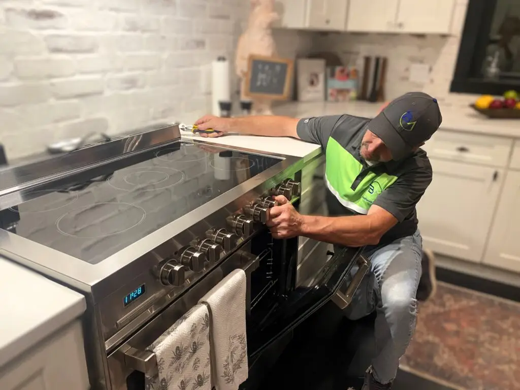 Dean Bigelow, founder of BA Appliance Repair Service, performing oven repair in Cincinnati.