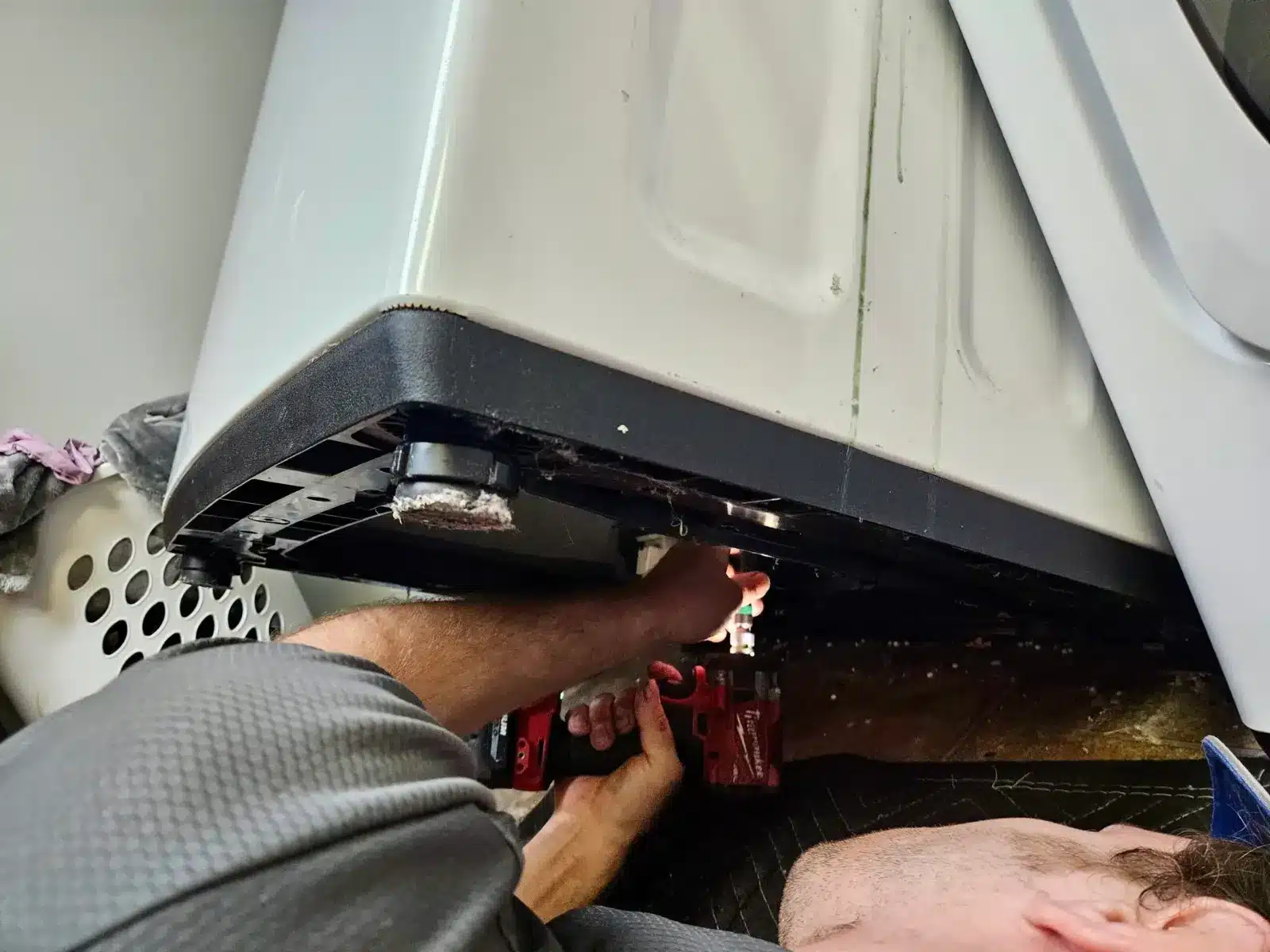 BA Appliance Repair technician servicing a washing machine