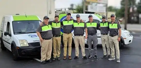 The BA Appliance Repair team in front of their branded service vans