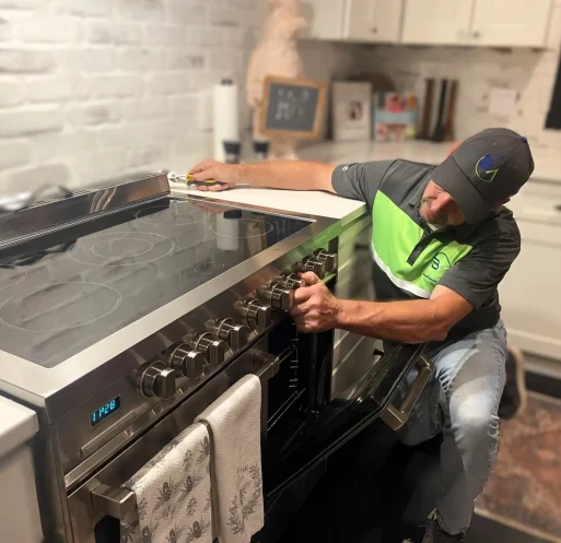 Dean Bigelow, founder of BA Appliance Repair Service, performing oven repair in Cincinnati.